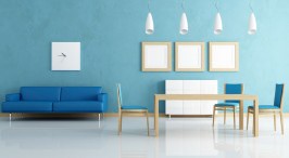 Modern living room with blue sofa and minimalist decor.